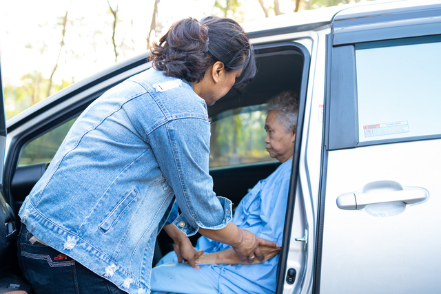 Help and support asian senior or elderly old lady woman patient get to her car, healthy strong medical concept.